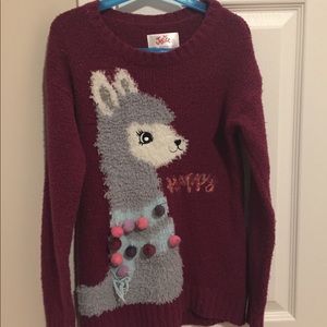 A soft maroon llama sweater